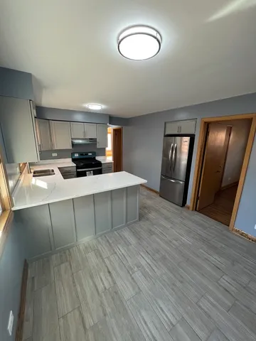 a room with a bed and a mirror