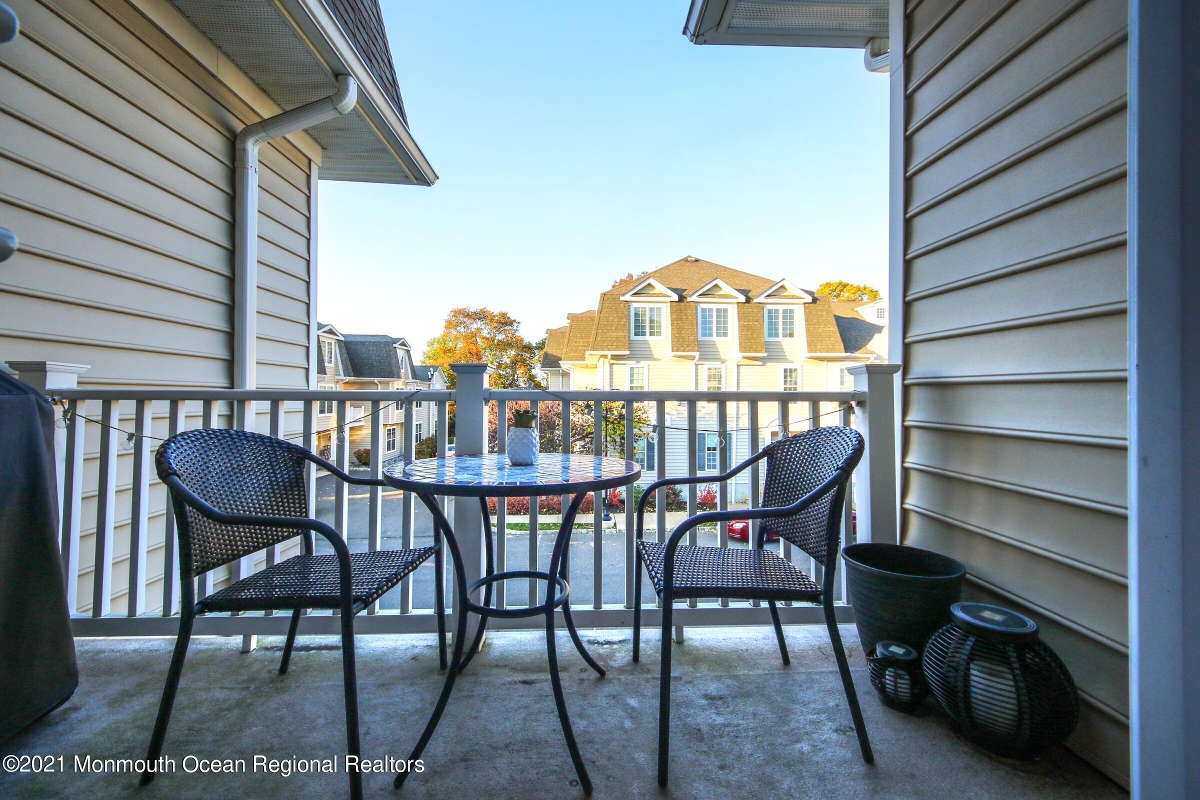 502 Abby Road Middletown, NJ 07748 - Photo 11 of 24 a view of a chairs and table in the balcony
