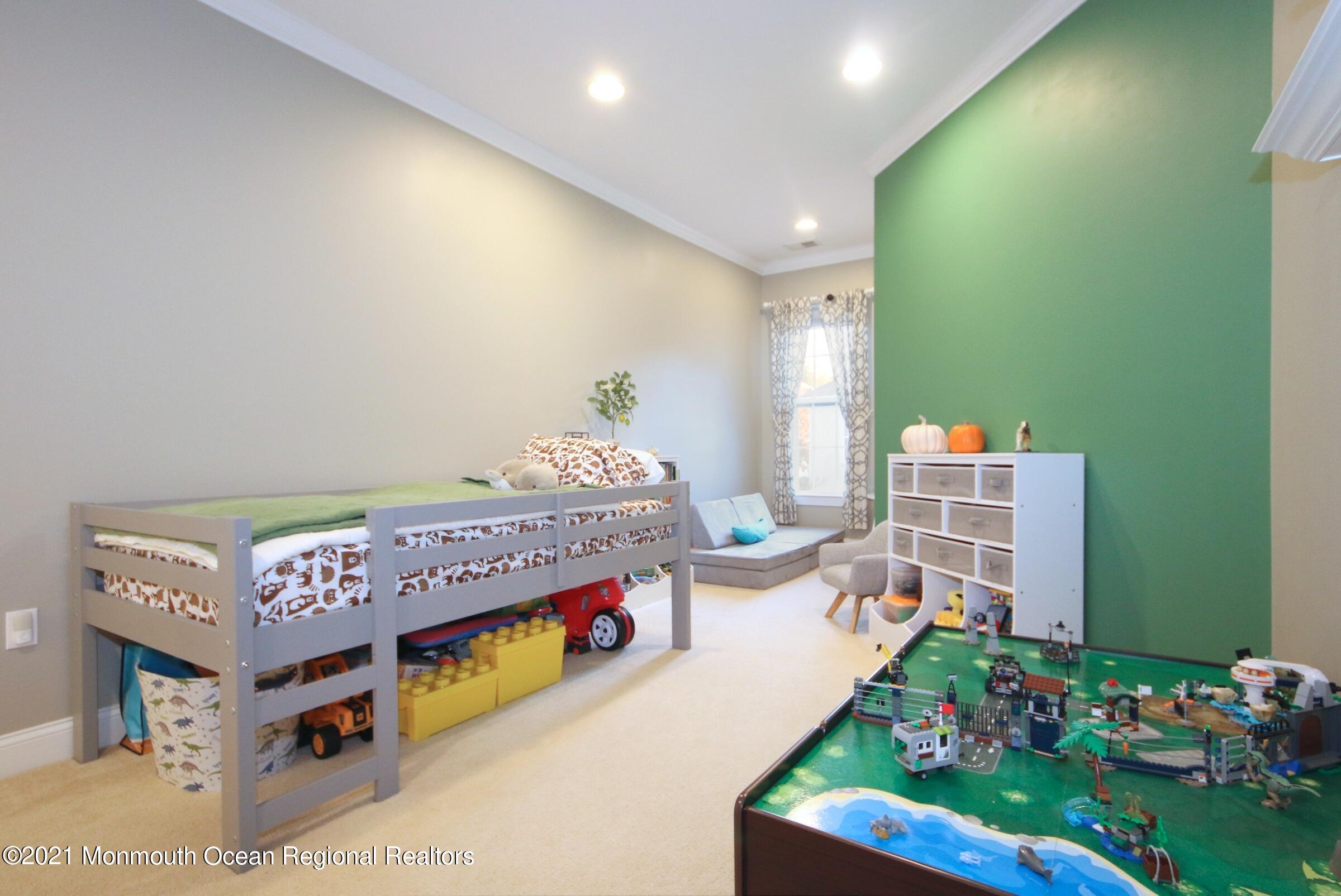 502 Abby Road Middletown, NJ 07748 - Photo 12 of 24 a room with furniture and a table