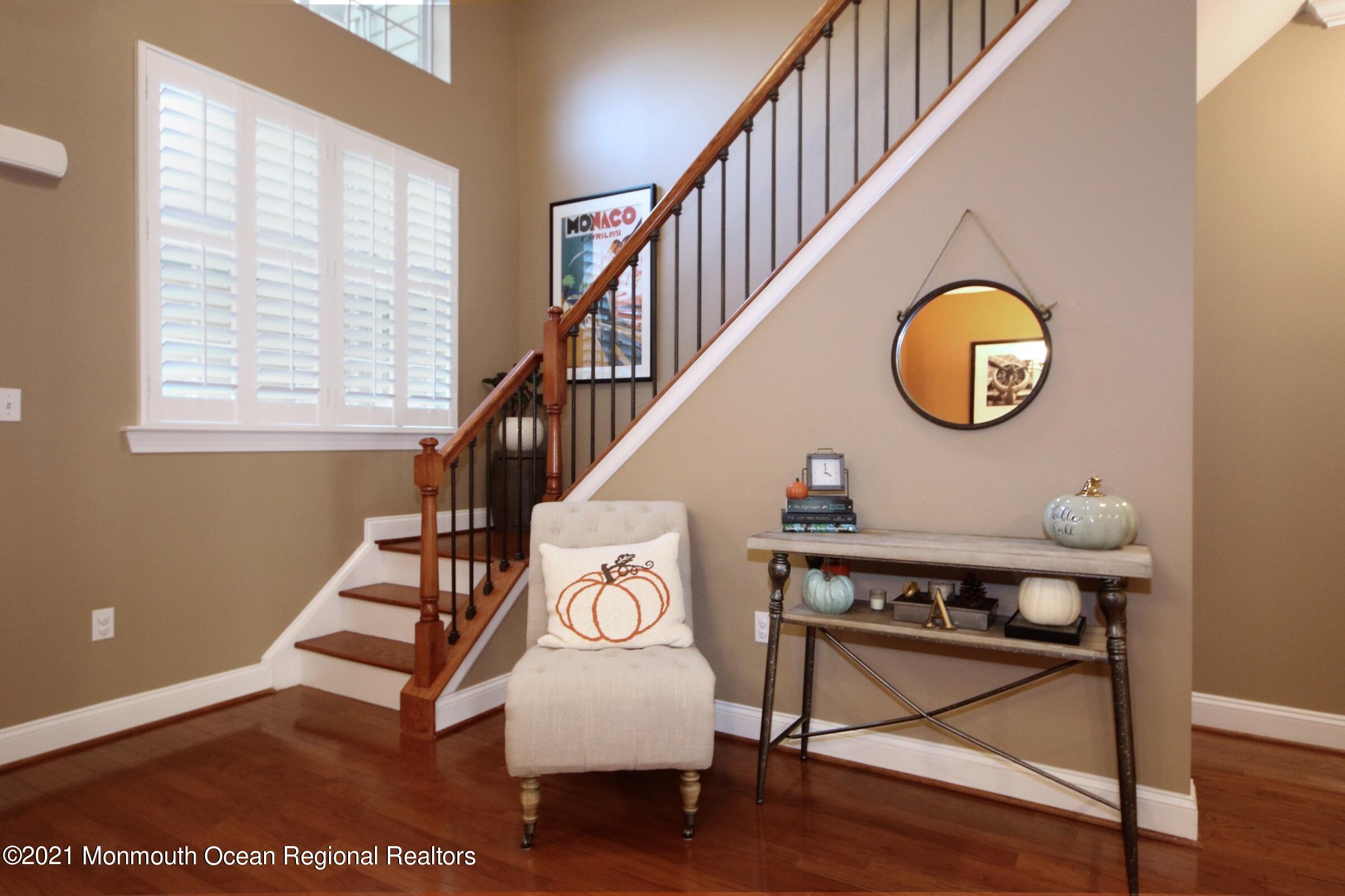502 Abby Road Middletown, NJ 07748 - Photo 15 of 24 a view of entryway with wooden floor and a potted plant