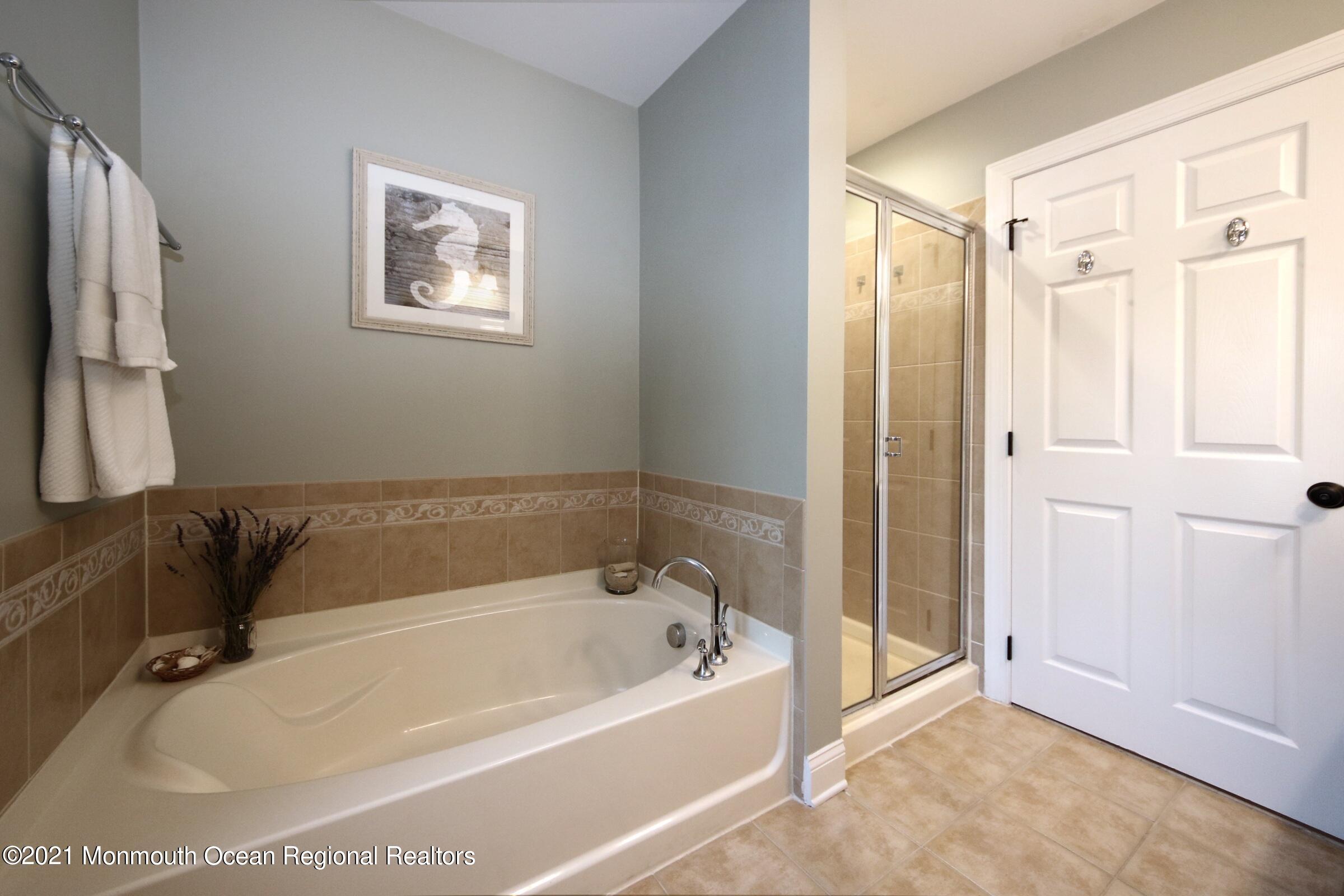 502 Abby Road Middletown, NJ 07748 - Photo 22 of 24 a white bath tub sitting next to a shower