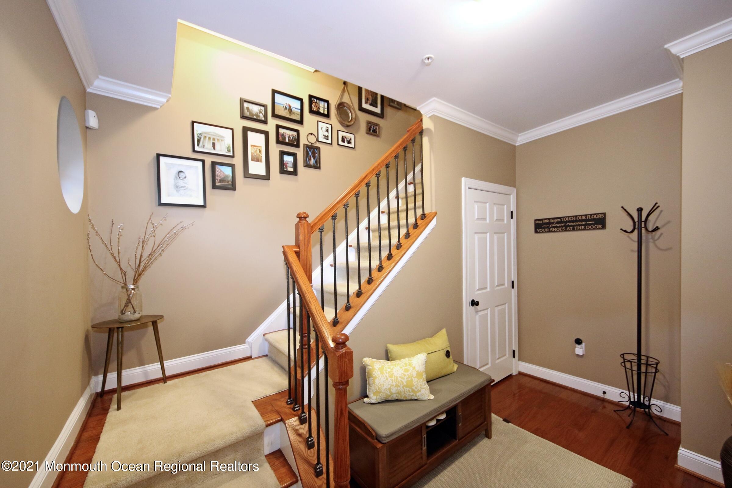 502 Abby Road Middletown, NJ 07748 - Photo 3 of 24 a view of a livingroom with furniture and stairs