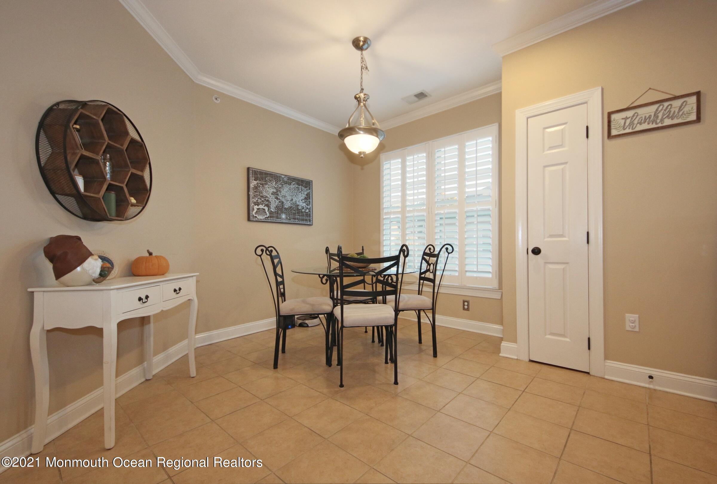 502 Abby Road Middletown, NJ 07748 - Photo 6 of 24 a view of a dining room with furniture and window