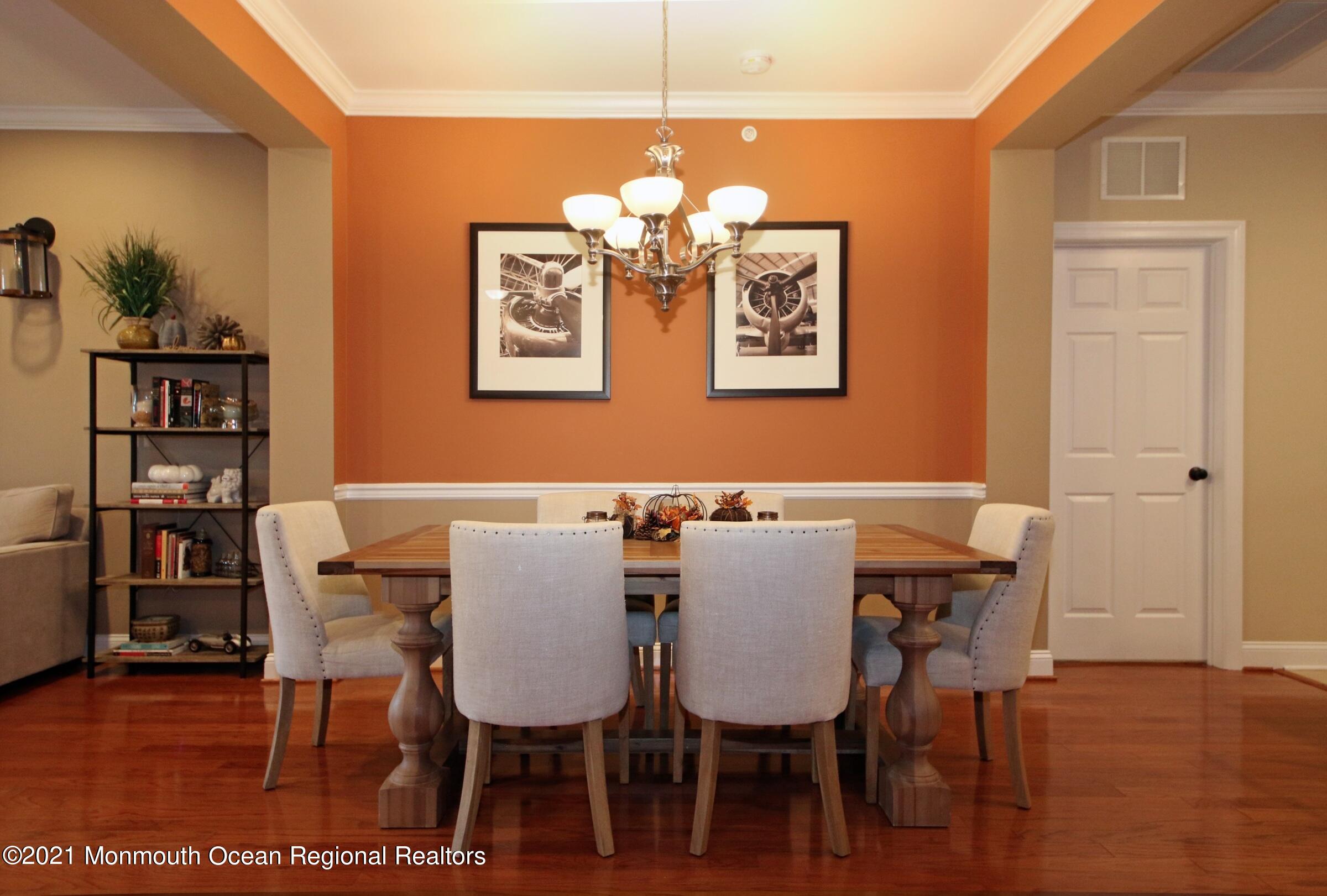 502 Abby Road Middletown, NJ 07748 - Photo 8 of 24 a view of a dining room with furniture and wooden floor