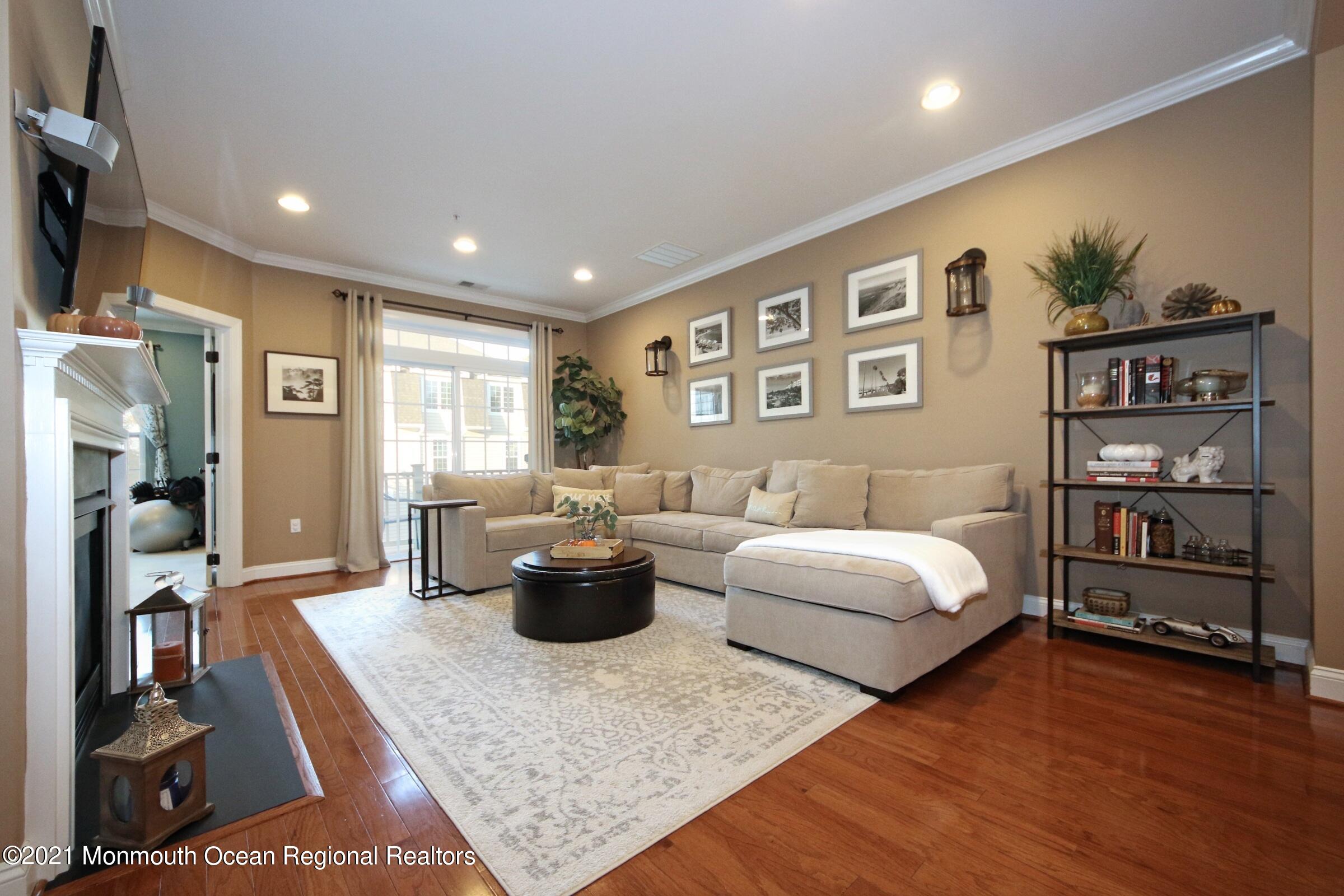 502 Abby Road Middletown, NJ 07748 - Photo 9 of 24 a living room with furniture and wooden floor