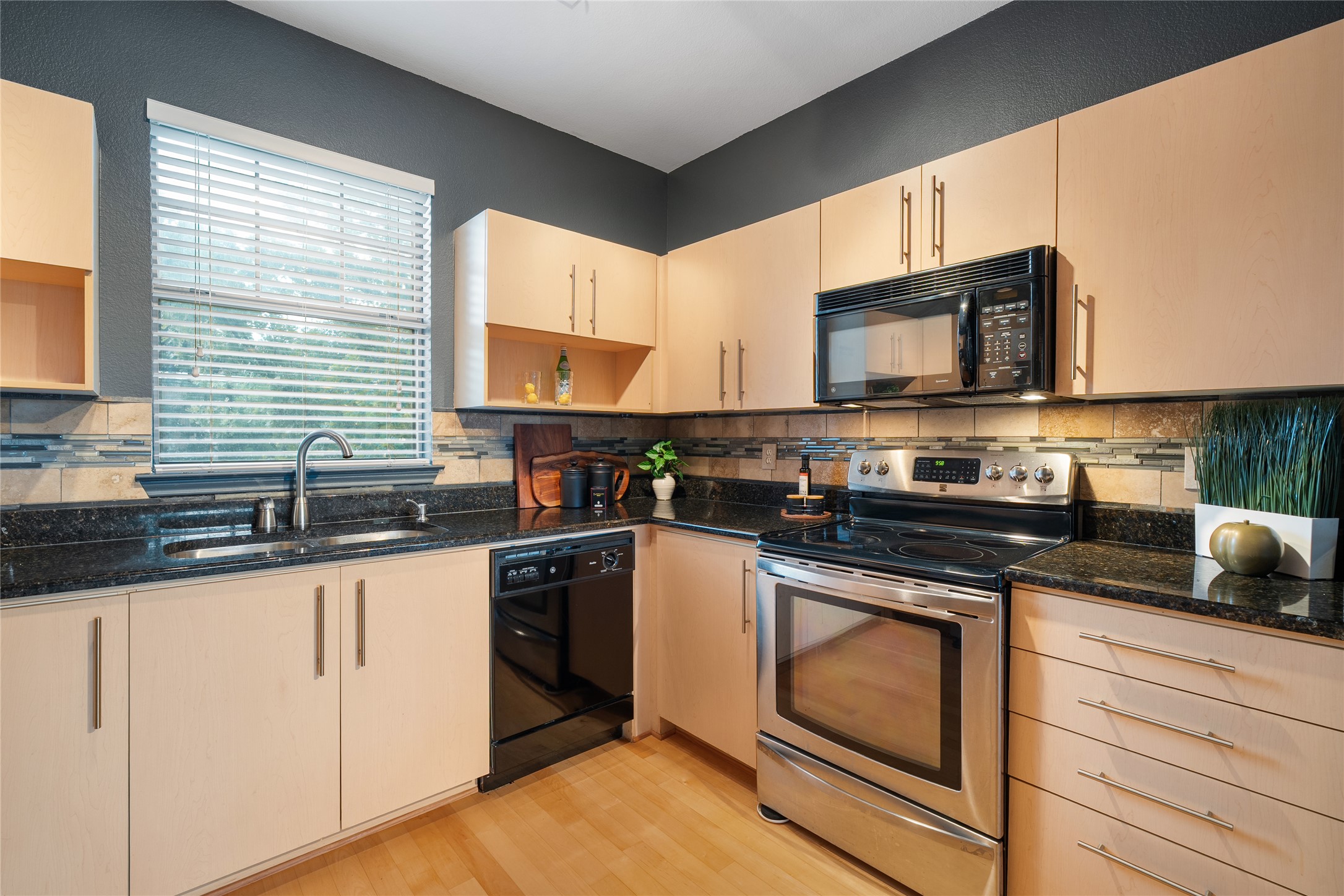 11203 Ranch Road 2222, Unit 1402 Austin, TX 78732 - Photo 5 of 22 Efficiently designed, this kitchen combines sleek appliances with ample counter space, perfect for culinary endeavors.