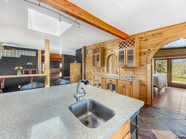 a kitchen with a sink and a refrigerator