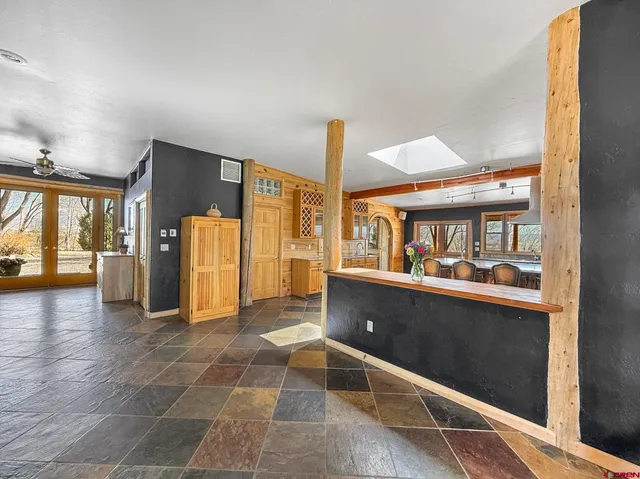 a view of living room with furniture and a window