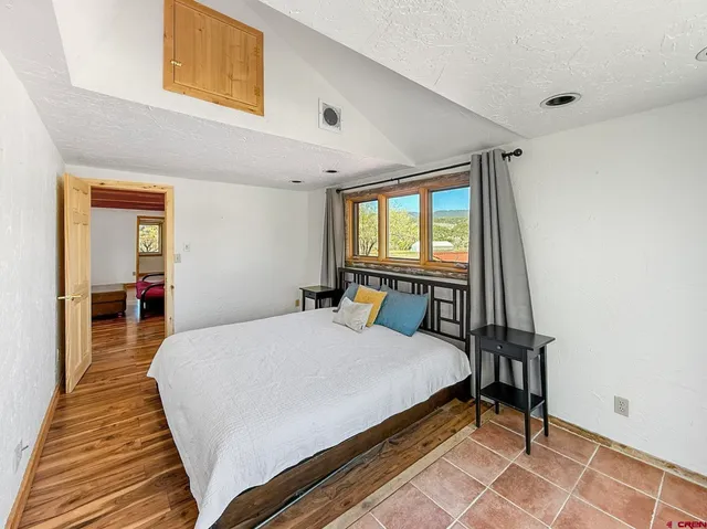 a bed room with a bed and a window