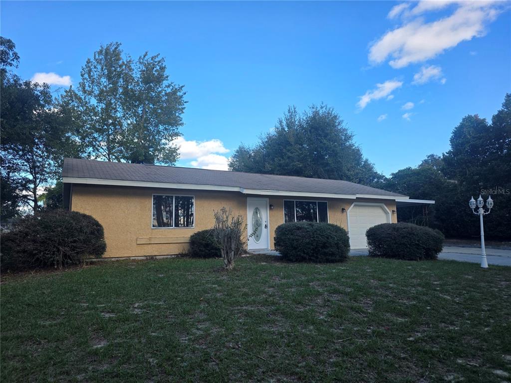 a house that is sitting in the grass