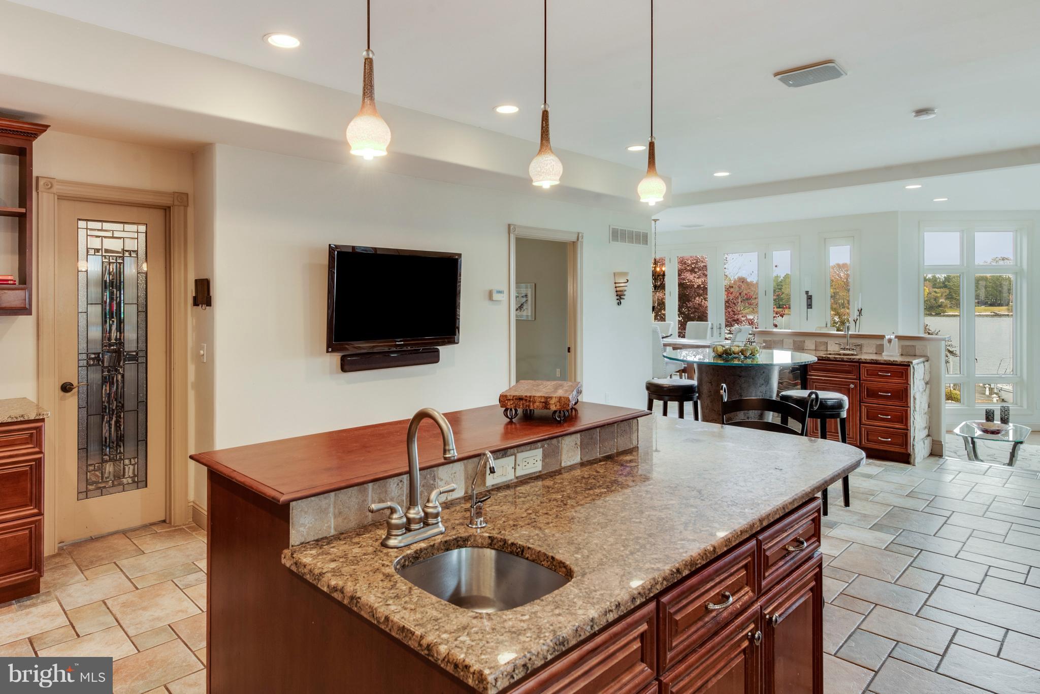 1795 Beachfield Road Annapolis, MD 21409 - Photo 14 of 49 a kitchen with stainless steel appliances granite countertop a sink a microwave oven and a counter top space