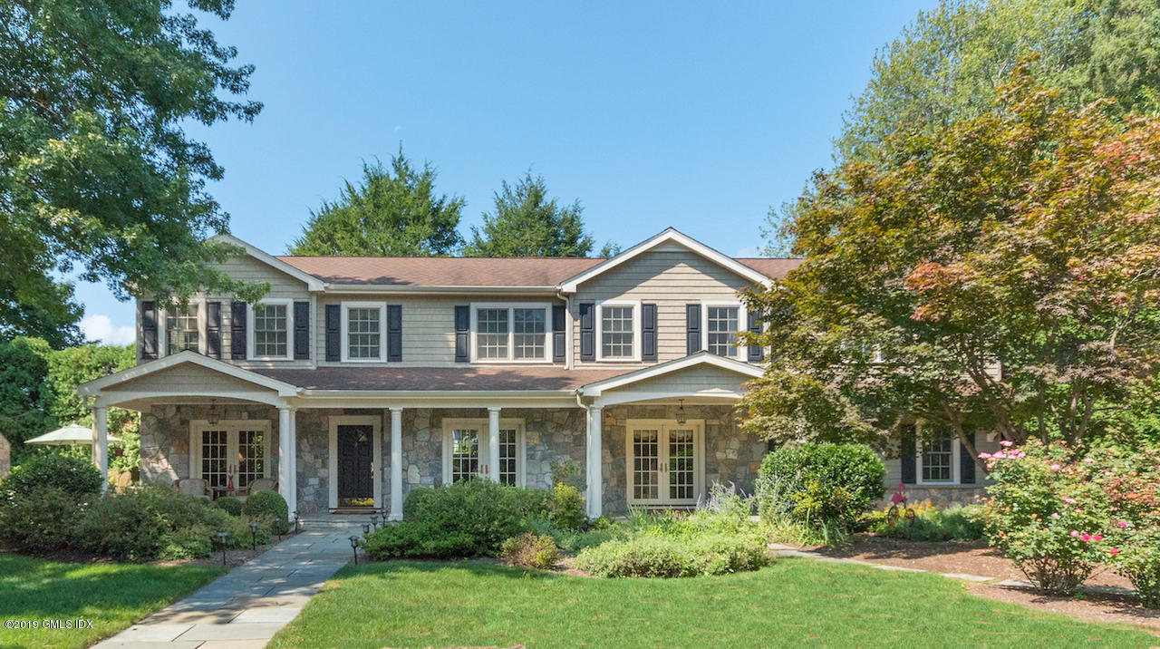 99 Lockwood Road Riverside, CT 06878 - Photo 1 of 21 a front view of a house with a yard