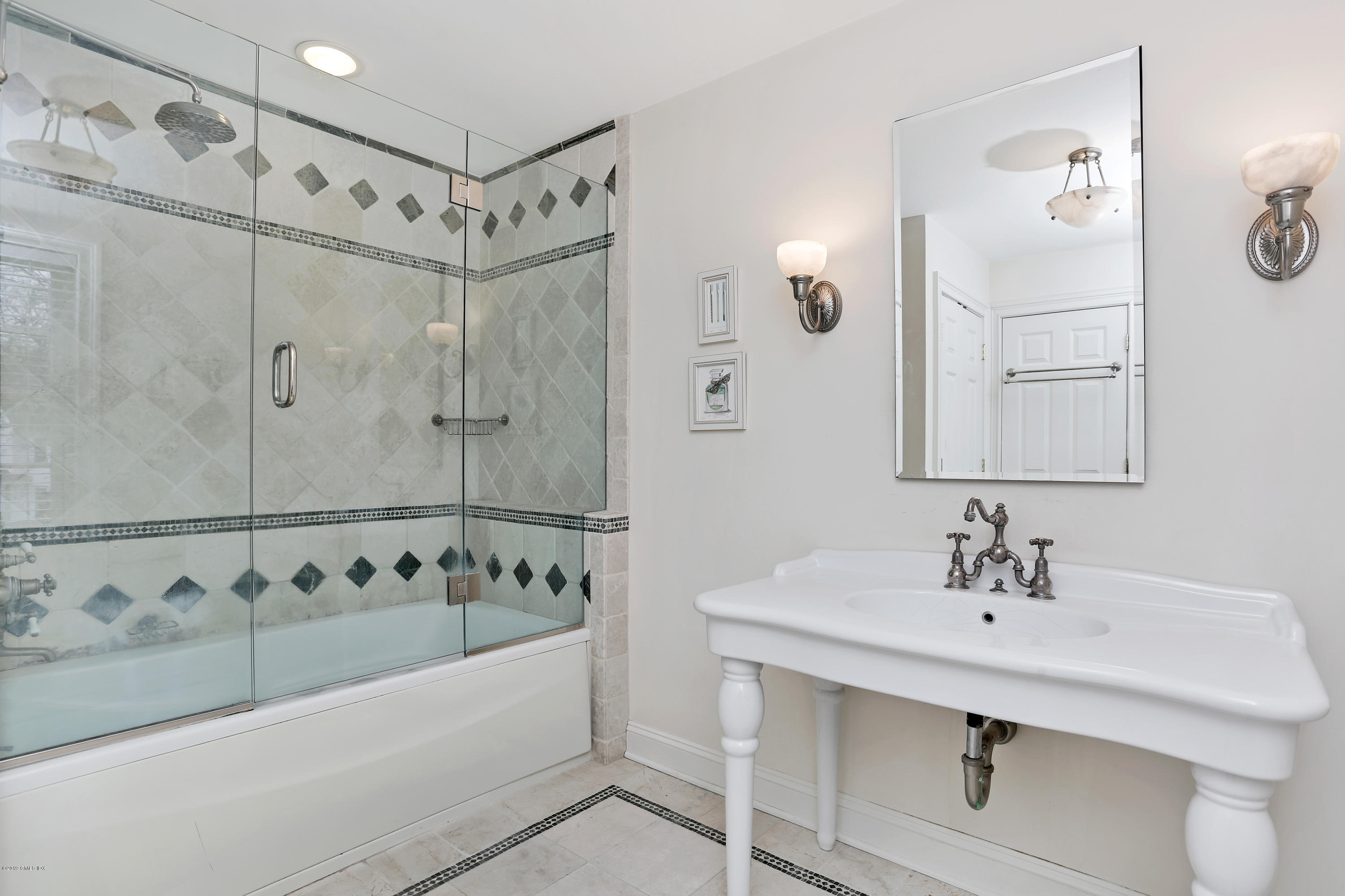 99 Lockwood Road Riverside, CT 06878 - Photo 16 of 21 a bathroom with a bathtub and a sink