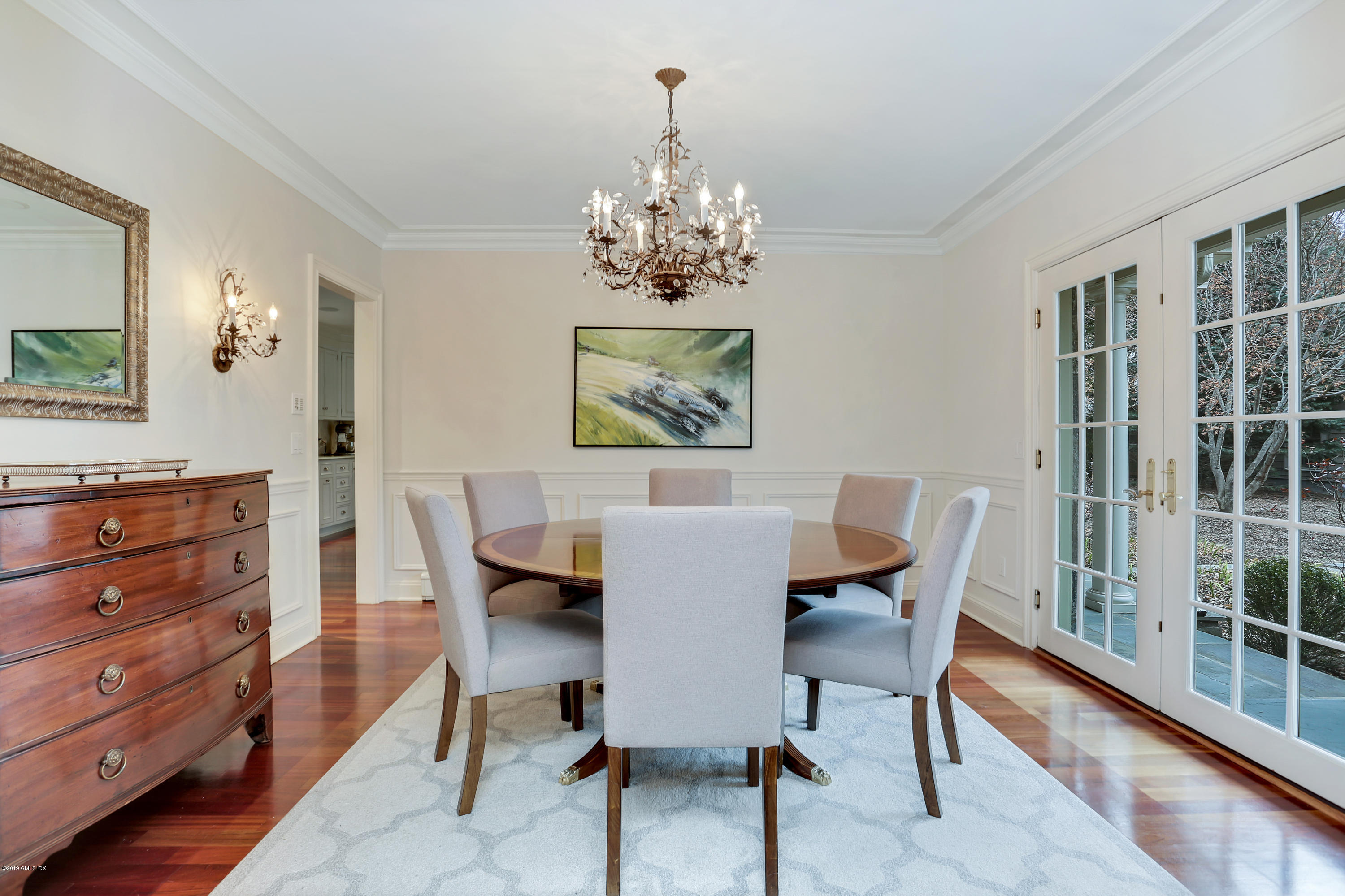 99 Lockwood Road Riverside, CT 06878 - Photo 5 of 21 a view of a dining room with furniture and chandelier