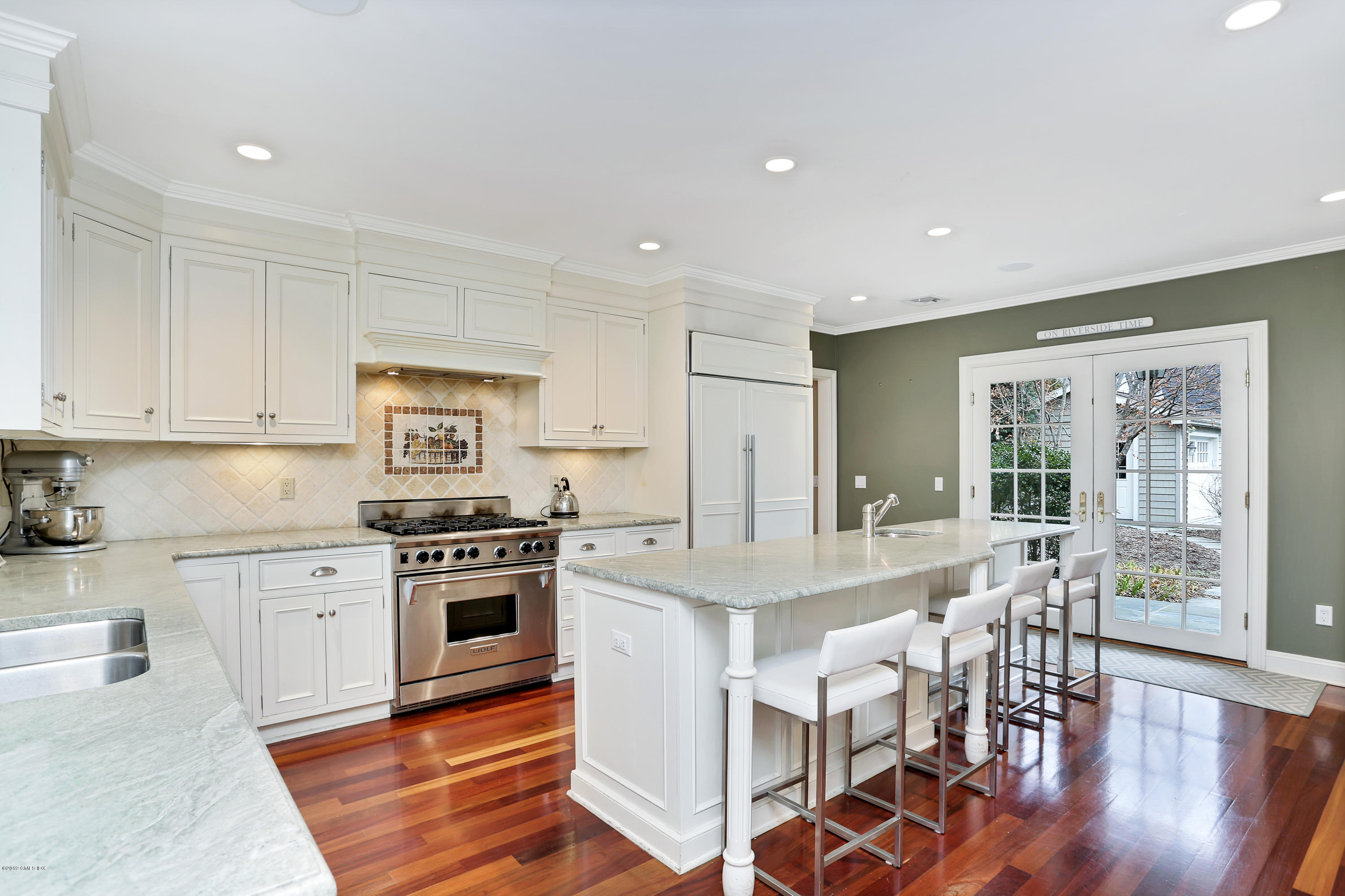 99 Lockwood Road Riverside, CT 06878 - Photo 8 of 21 a large kitchen with cabinets table and chairs