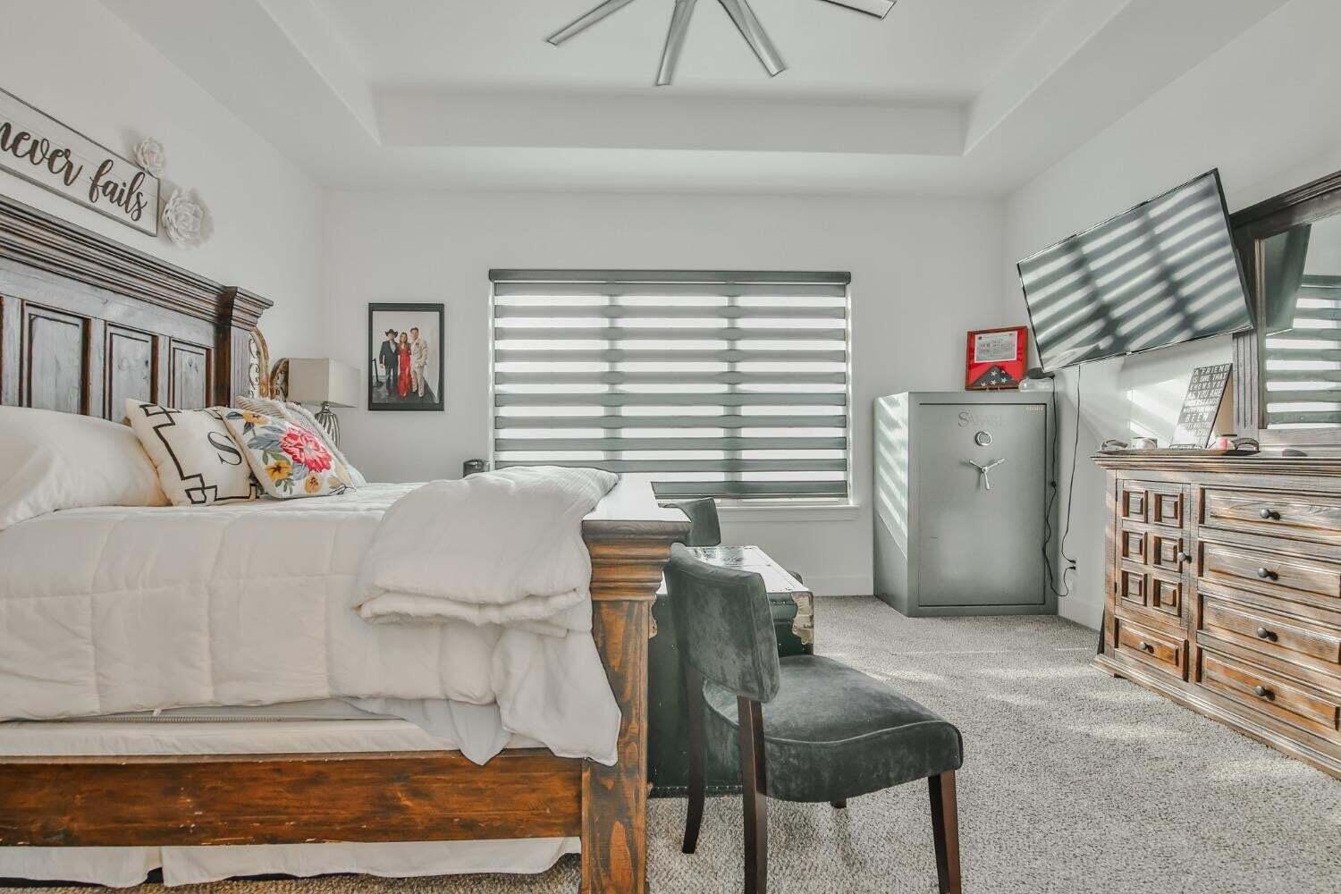 19210 County Road 2240 Lubbock, TX 79423 - Photo 15 of 46 a bed room with a bed and a window