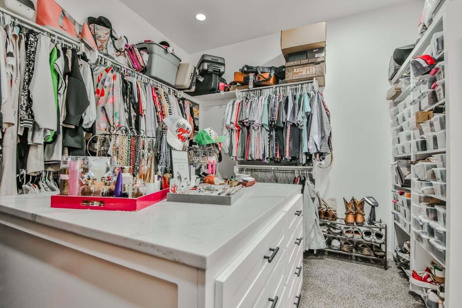 19210 County Road 2240 Lubbock, TX 79423 - Photo 20 of 46 a view of walk in closet with clothes and shoes