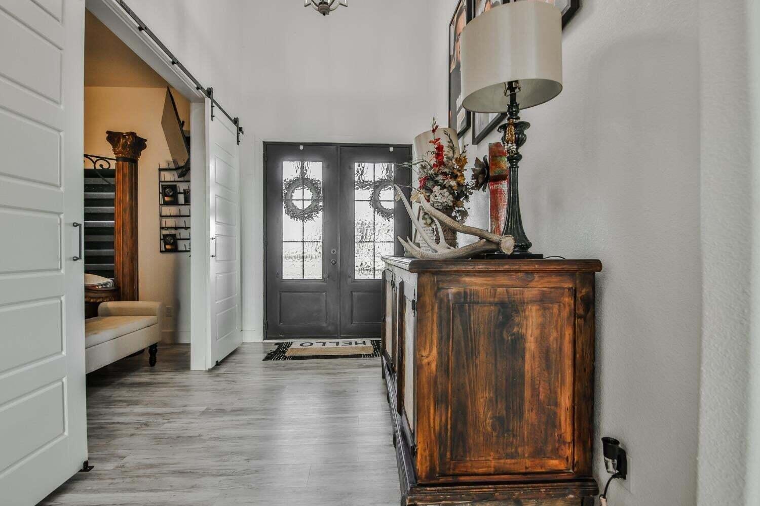 19210 County Road 2240 Lubbock, TX 79423 - Photo 2 of 46 a view of hallway with livingroom and furniture
