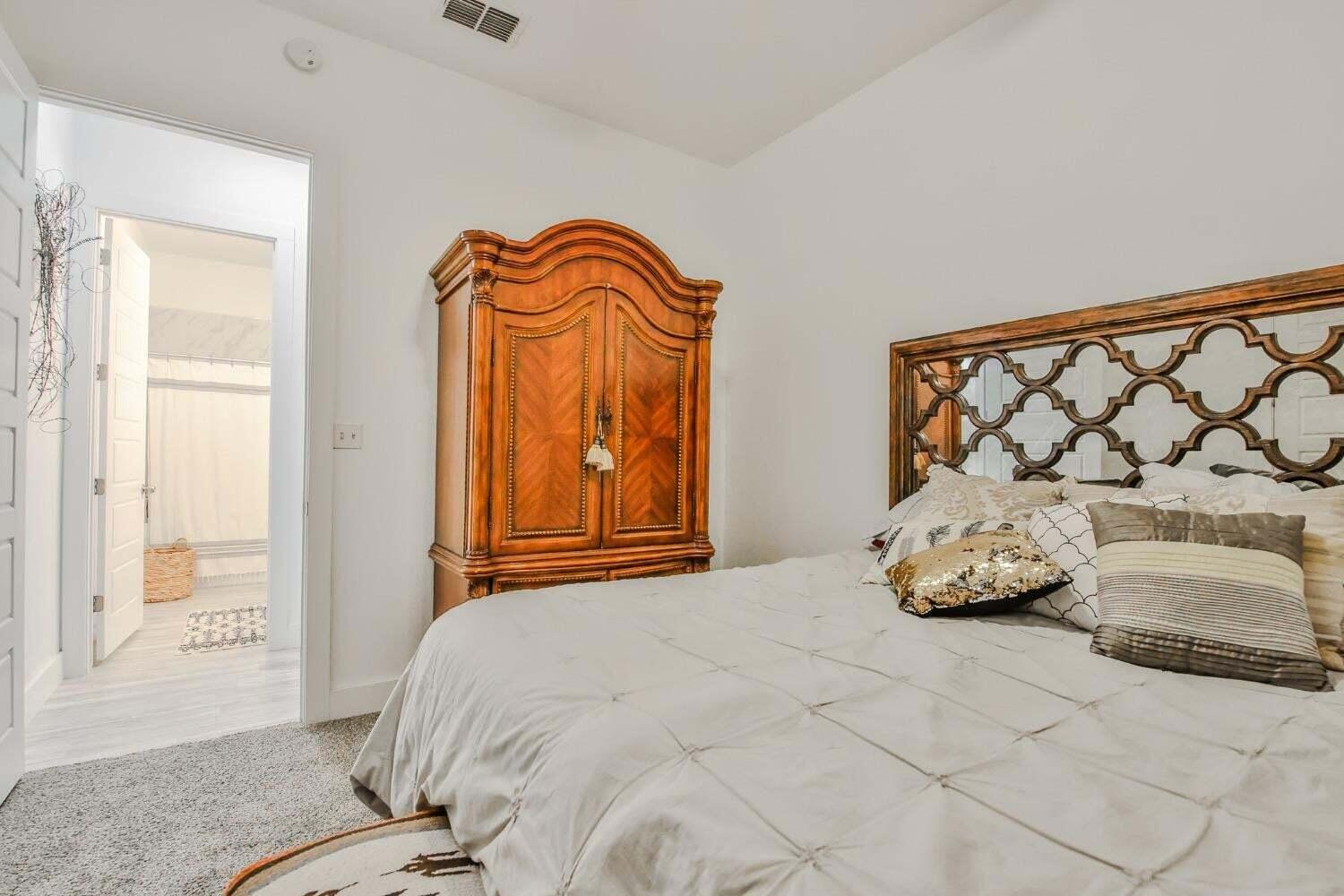 19210 County Road 2240 Lubbock, TX 79423 - Photo 31 of 46 a bedroom with a bed and a window