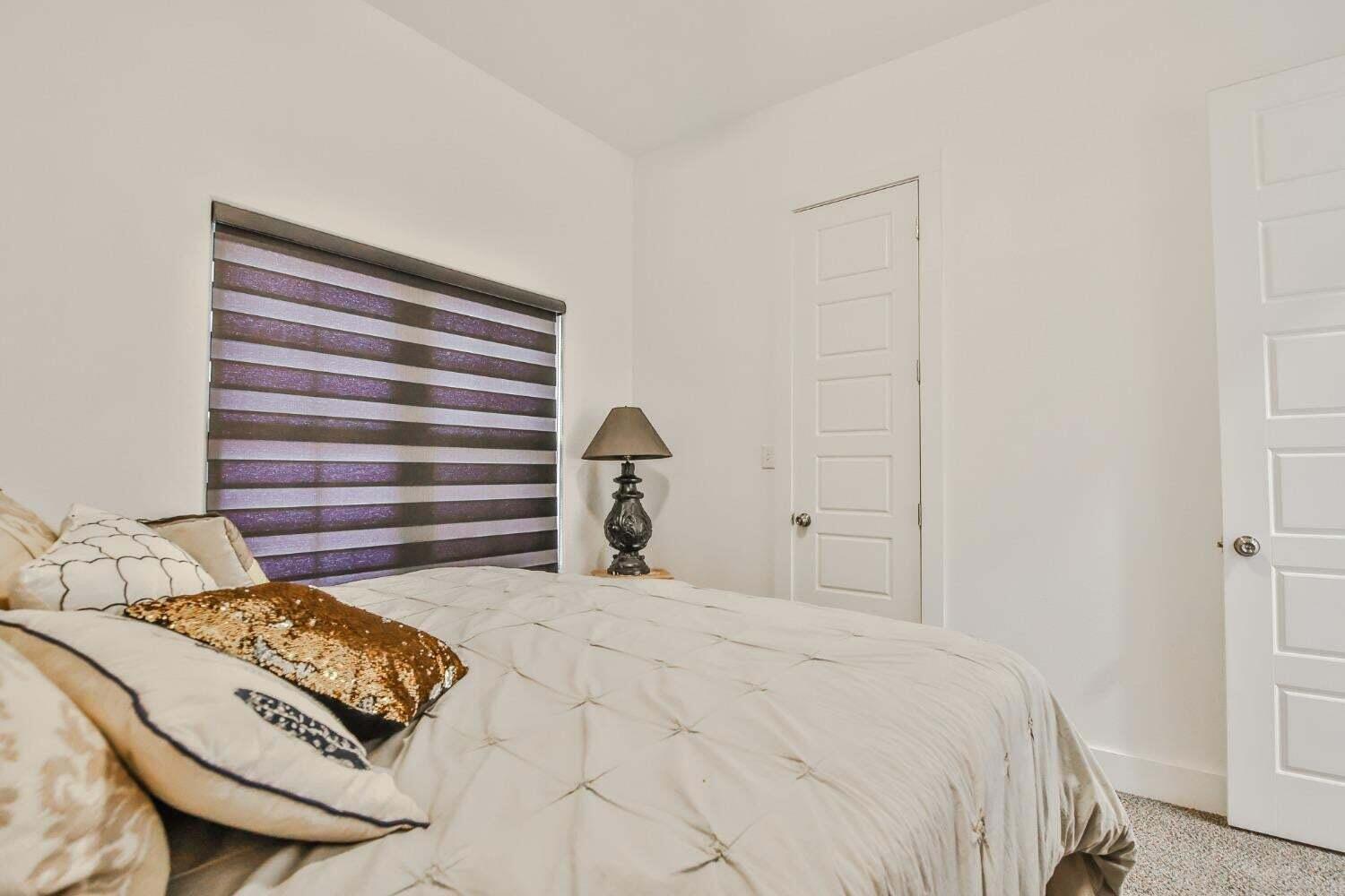 19210 County Road 2240 Lubbock, TX 79423 - Photo 32 of 46 a bedroom with a bed and a cabinets