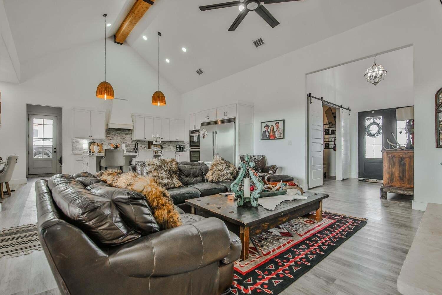 19210 County Road 2240 Lubbock, TX 79423 - Photo 6 of 46 a living room with furniture and wooden floor