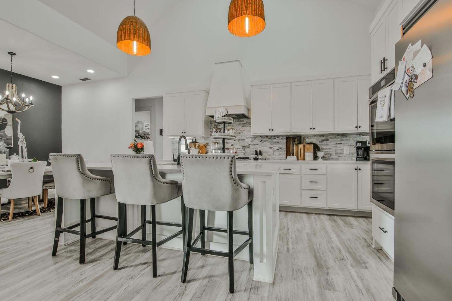 19210 County Road 2240 Lubbock, TX 79423 - Photo 9 of 46 a kitchen with a sink cabinets and window