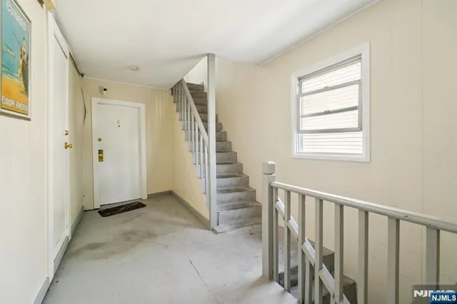 an entryway of a livingroom with a window