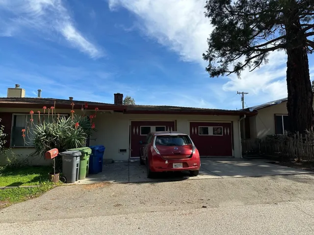 a car parked in front of a house