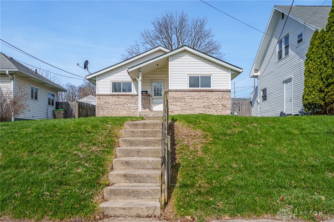 This charming home features a lovely facade, inviting you to a serene living experience.
