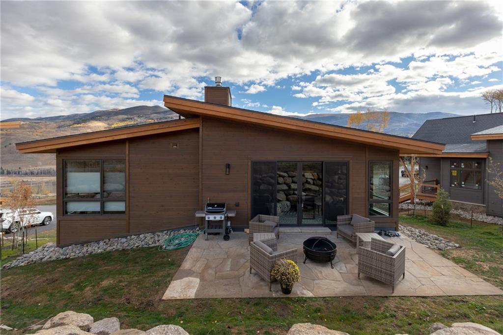 137 Moss Way Silverthorne, CO 80498 - Photo 2 of 25 a view of a house with backyard porch and sitting area