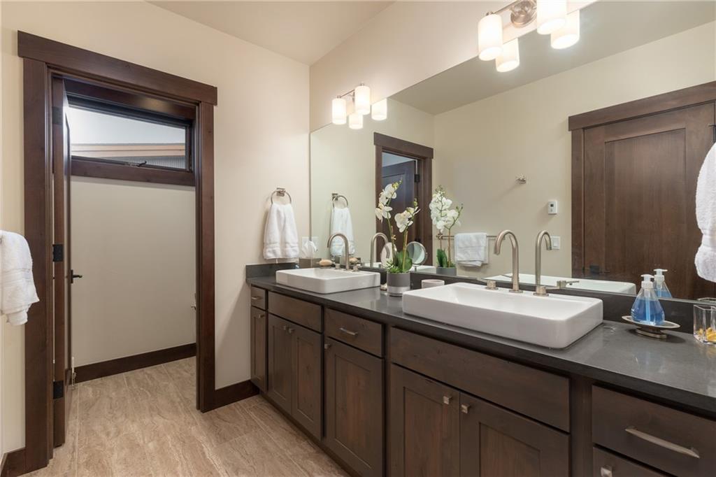 137 Moss Way Silverthorne, CO 80498 - Photo 15 of 25 a bathroom with a double vanity sink and a mirror