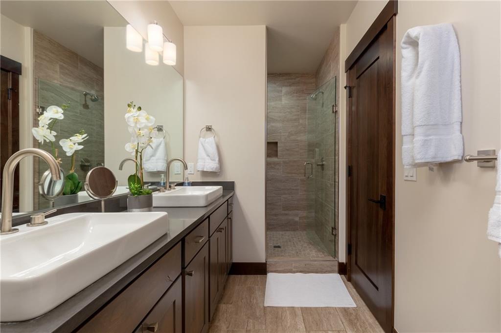 137 Moss Way Silverthorne, CO 80498 - Photo 16 of 25 a bathroom with a sink and a mirror