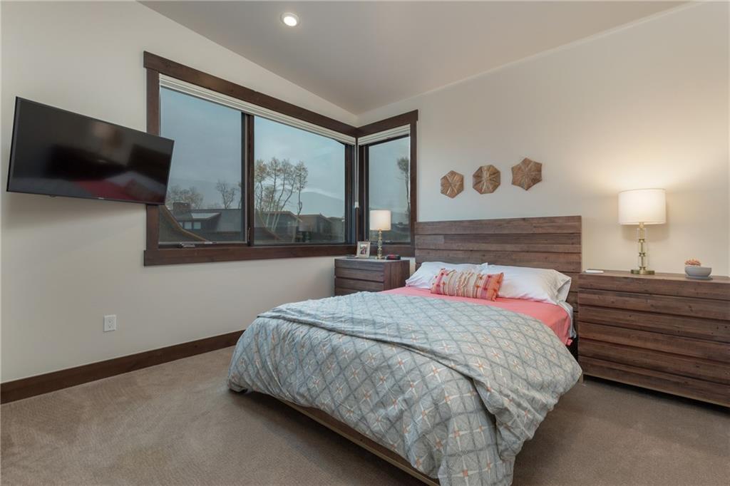 137 Moss Way Silverthorne, CO 80498 - Photo 17 of 25 a bedroom with a bed and window