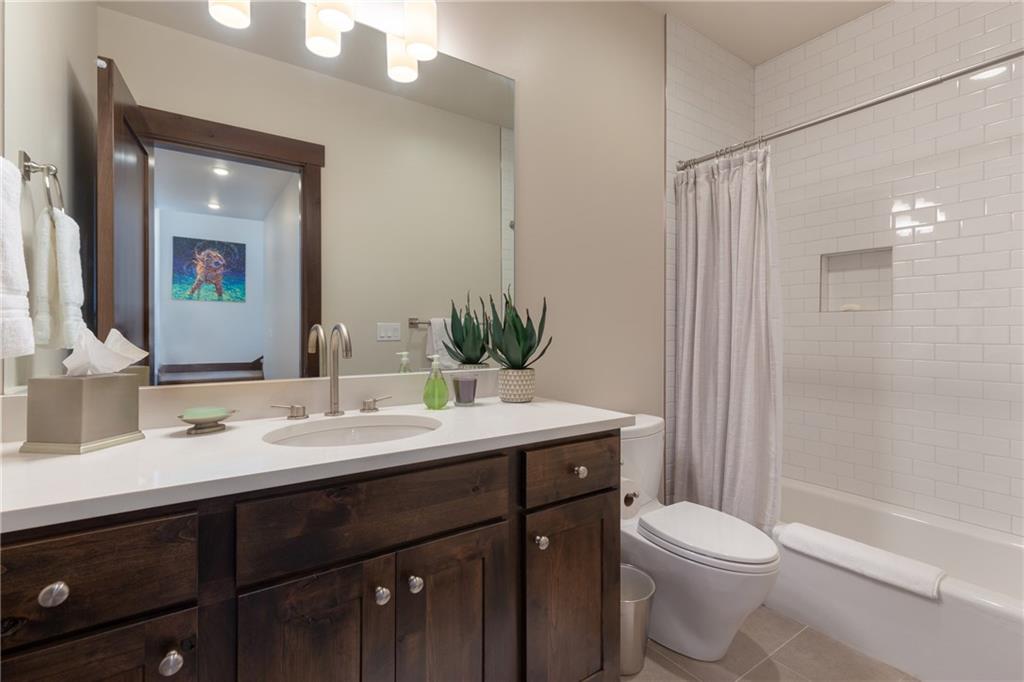137 Moss Way Silverthorne, CO 80498 - Photo 21 of 25 a bathroom with a sink vanity mirror and toilet