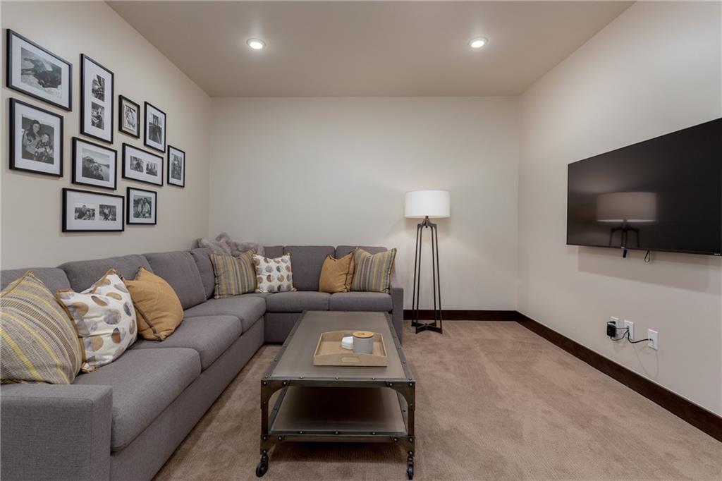 137 Moss Way Silverthorne, CO 80498 - Photo 23 of 25 a living room with furniture and a flat screen tv