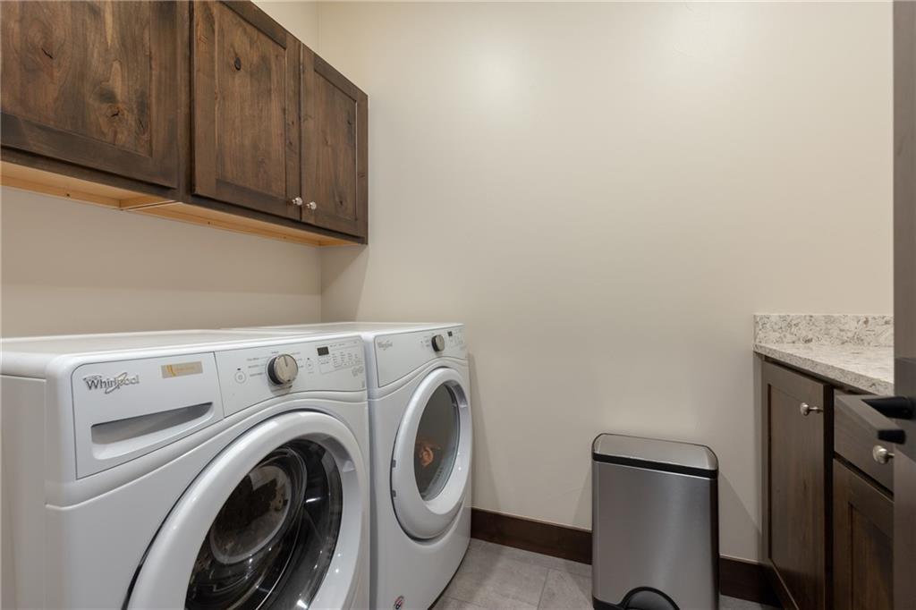 137 Moss Way Silverthorne, CO 80498 - Photo 24 of 25 a utility room with dryer and washer