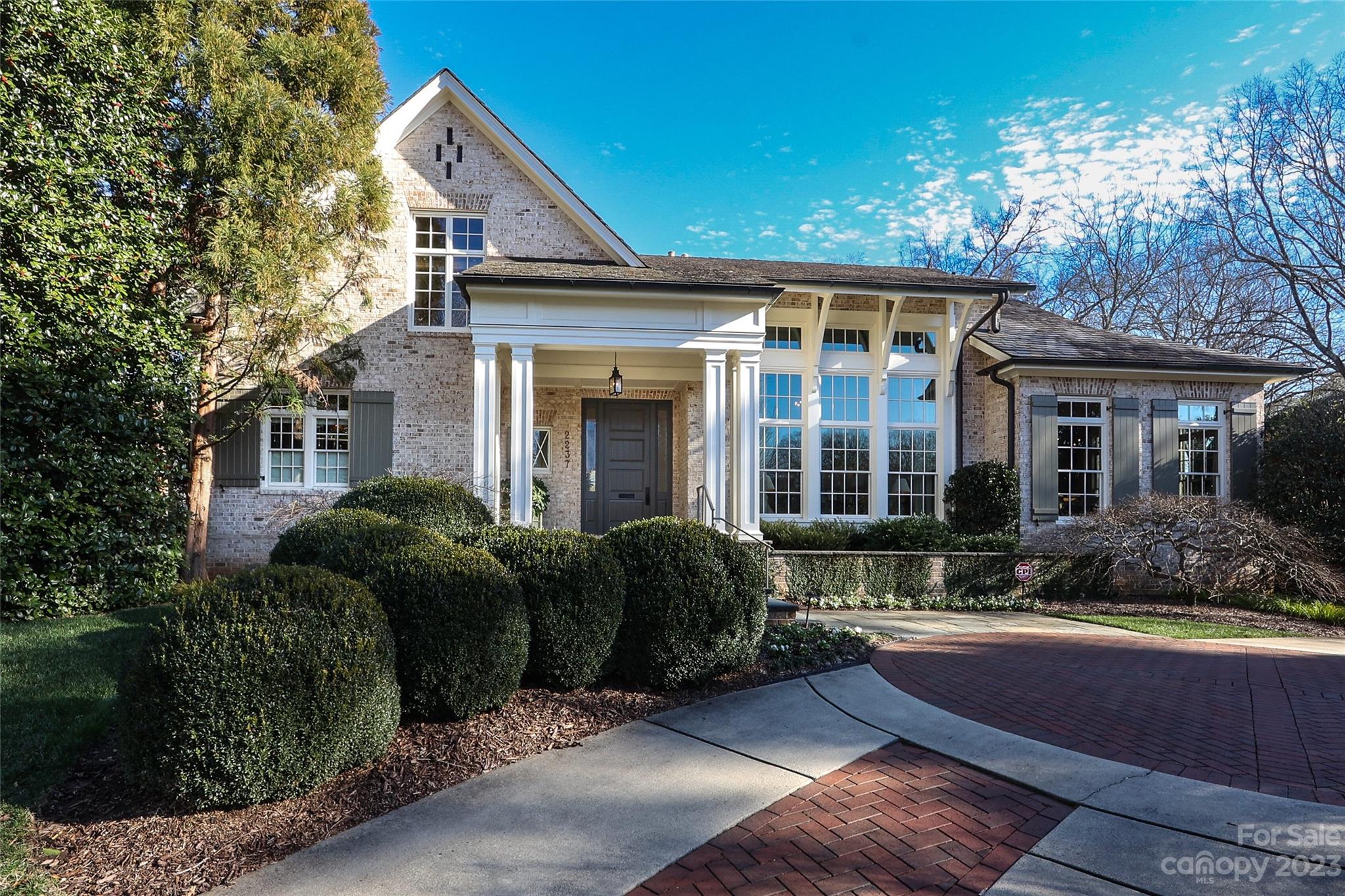 2237 Queens Road East Charlotte, NC 28207 - Photo 1 of 40 a front view of a house with garden