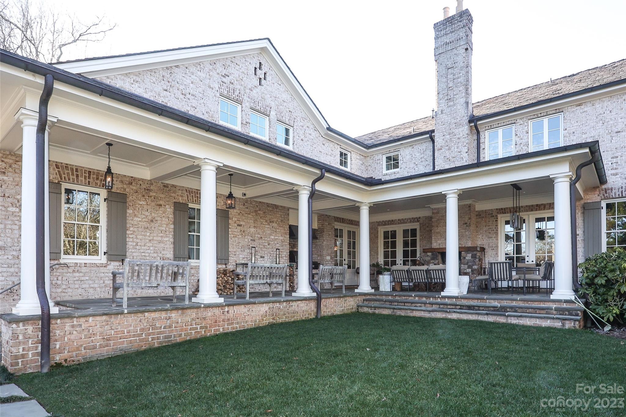 2237 Queens Road East Charlotte, NC 28207 - Photo 36 of 40 a view of a patio with table and chairs and garden