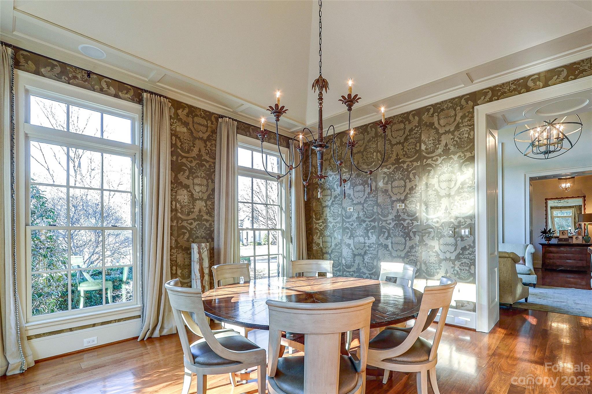 2237 Queens Road East Charlotte, NC 28207 - Photo 6 of 40 a view of a dining room with furniture wooden floor and chandelier