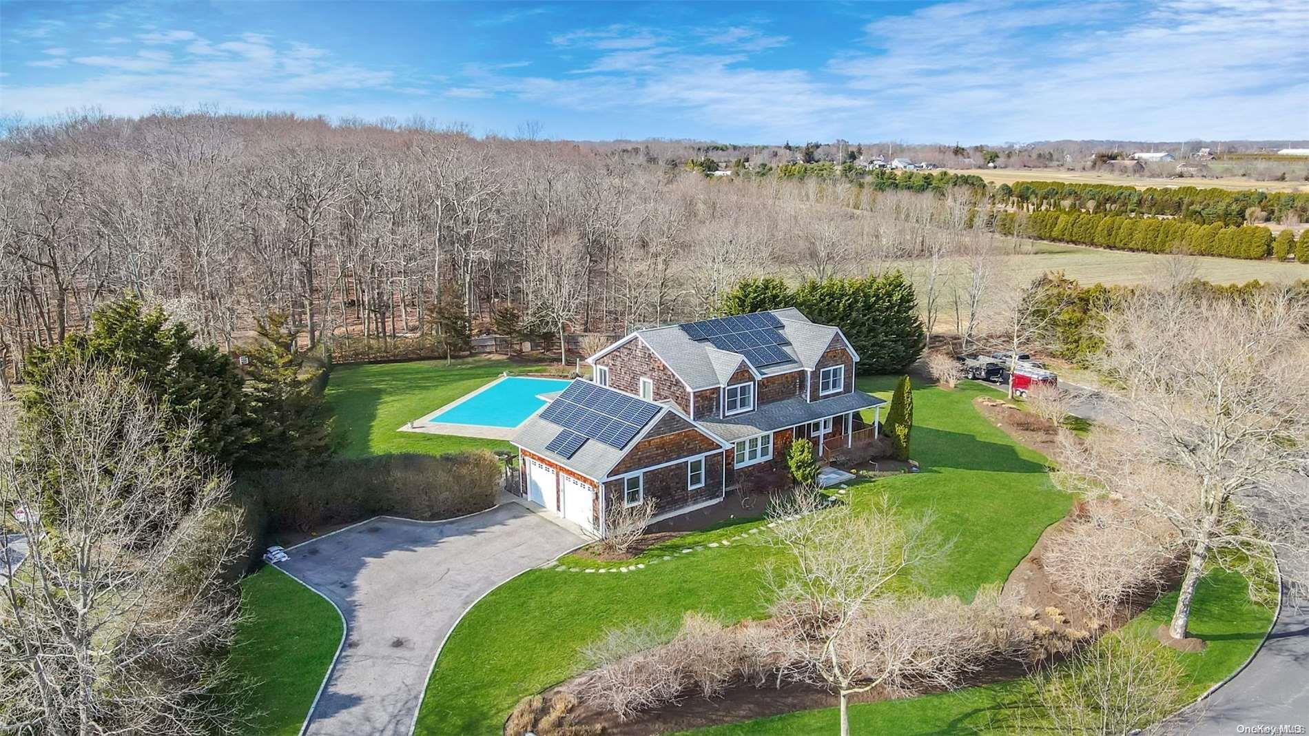 an aerial view of a house with a lake view
