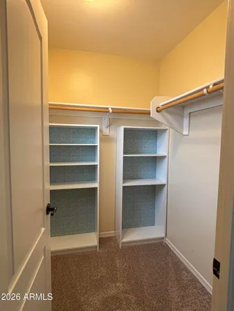 a view of an empty walk in closet