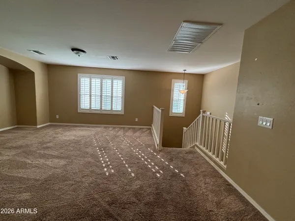 a view of an empty room with a fireplace