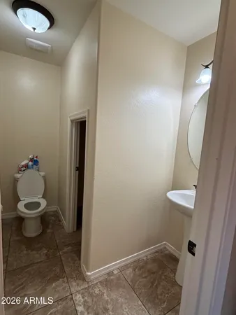 a bathroom with a toilet and a sink