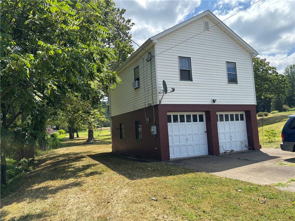 264 Hopwood Fairchance Road Uniontown, PA 15401 - Photo 13 of 19 a view of a house with a yard