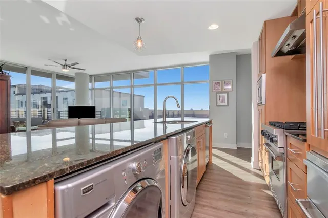 a bed room with a bed mirror and a window