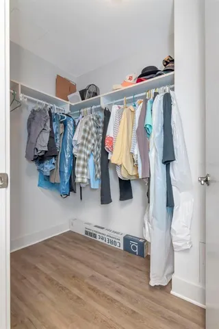 a view of a balcony with wooden benches