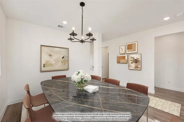 a view of a dining room with furniture