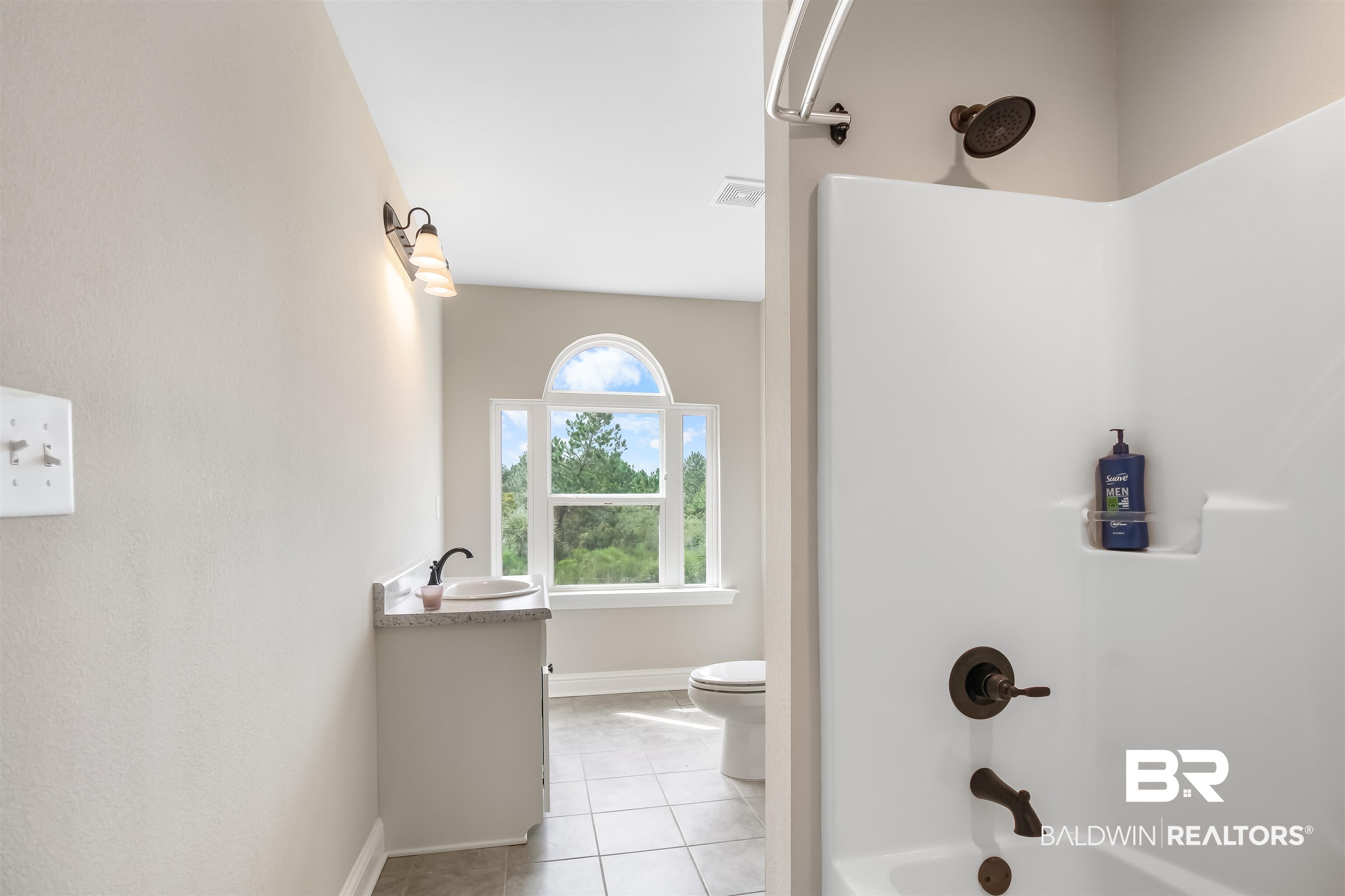 26197 Eagle Trace Elberta, AL 36530 - Photo 7 of 26 Full bathroom featuring vanity, toilet, bathtub / shower combination, and tile patterned floors