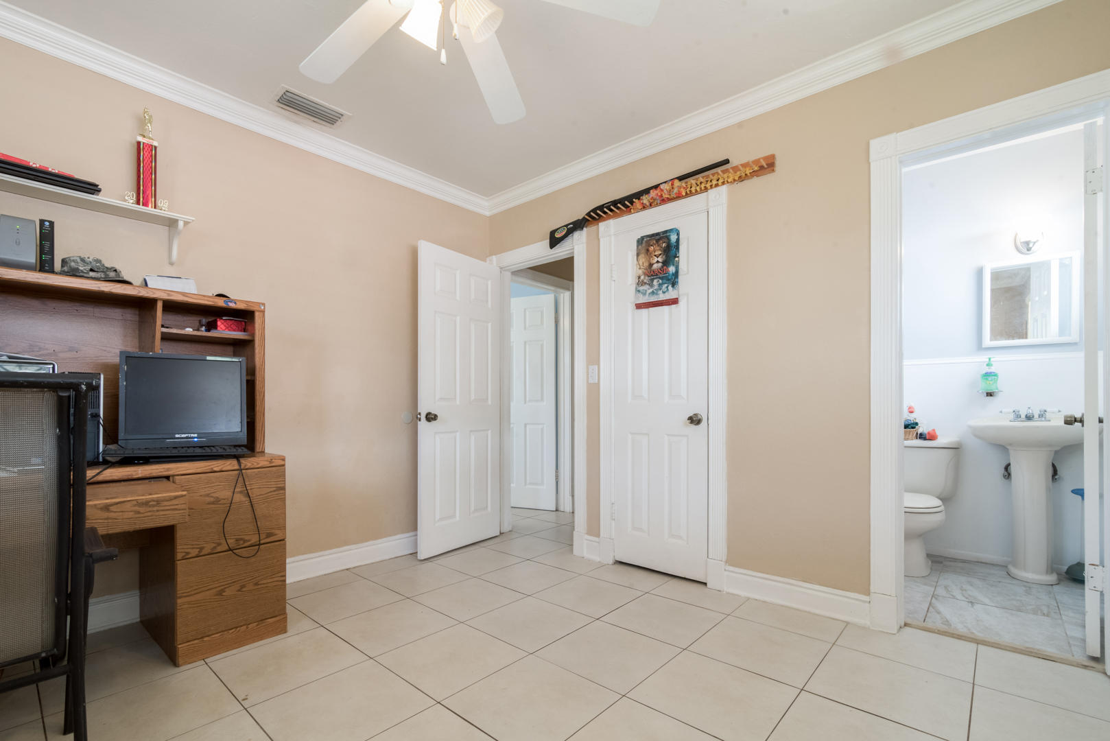 320 East Lake Road Palm Springs, FL 33461 - Photo 16 of 22 a view of kitchen with refrigerator cabinets and flat screen tv