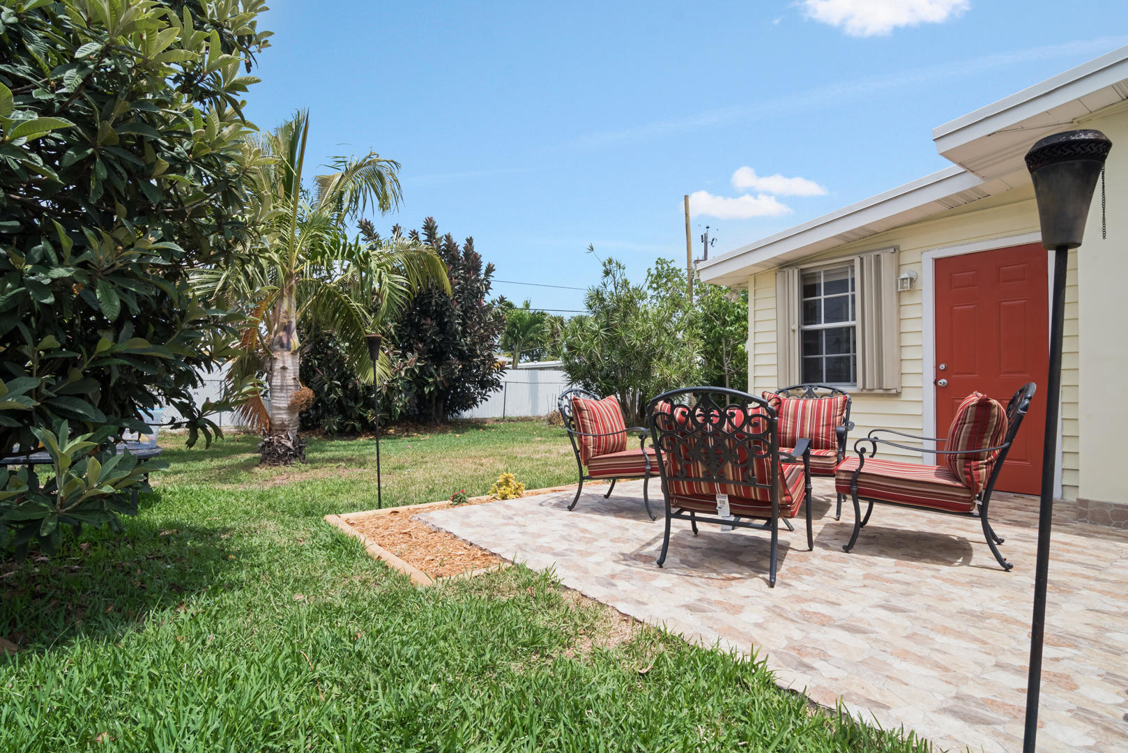 320 East Lake Road Palm Springs, FL 33461 - Photo 19 of 22 a view of a backyard with furniture